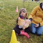 Students interacting with animals outdoors as part of NCI's outdoor learning program in 2020.