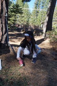 A learner in an outdoor learning space as a part of Sierra Nevada Journeys' 2020 pandemic pilot.