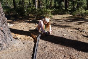 A learner in an outdoor learning space as a part of Sierra Nevada Journeys' 2020 pandemic pilot.