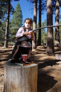 A learner in an outdoor learning space as a part of Sierra Nevada Journeys' 2020 pandemic pilot.