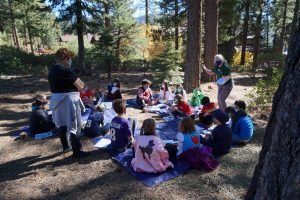 Learners in an outdoor learning space as a part of Sierra Nevada Journeys' 2020 pandemic pilot.