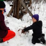 Students learning in the snow with Wolf Ridge Environmental Learning Center's outdoor learning program in 2020.