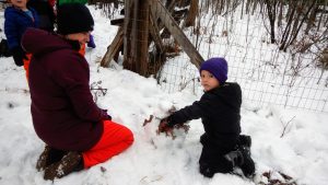 Students learning in the snow with Wolf Ridge Environmental Learning Center's outdoor learning program in 2020.