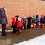 Students learning in the snow with Wolf Ridge Environmental Learning Center's outdoor learning program in 2020.