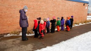 Students learning in the snow with Wolf Ridge Environmental Learning Center's outdoor learning program in 2020.